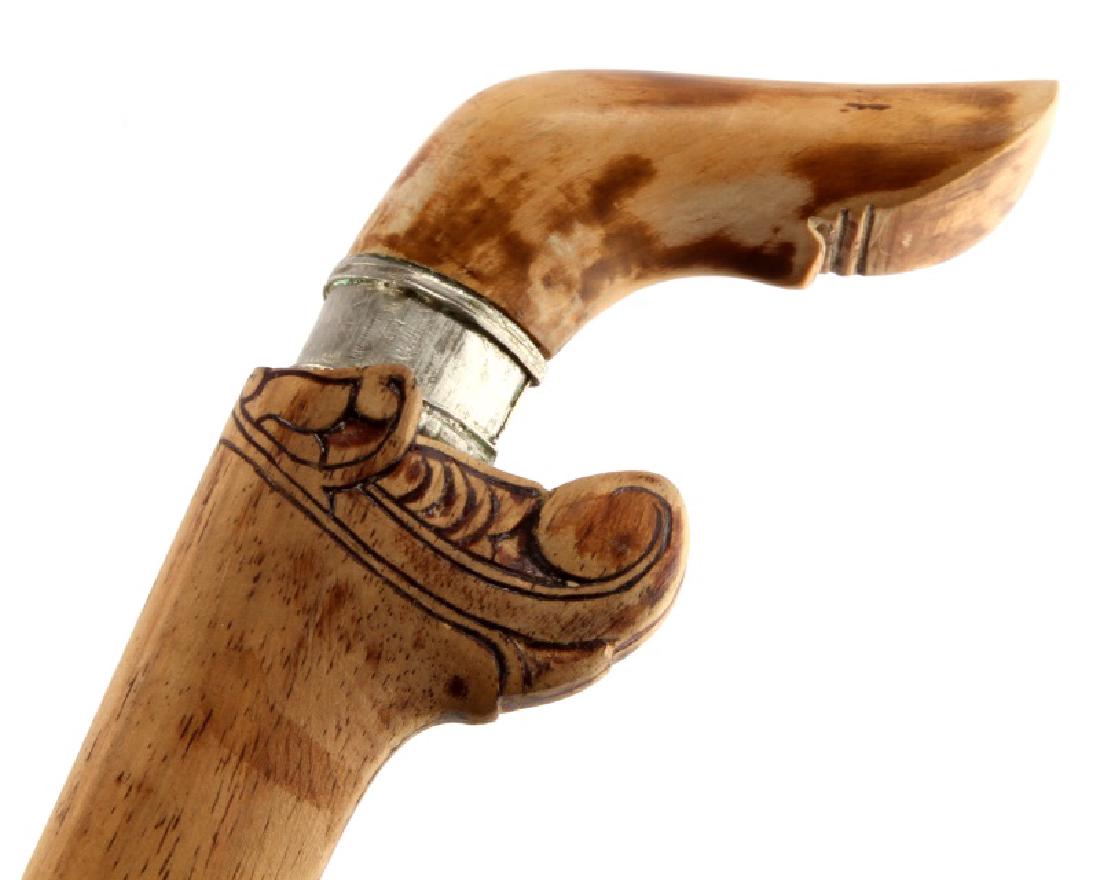 INDONESIAN BADIK MAKASSAR DAGGER SULAWESI CELEBES: A Badik Macassar dagger also called a Badik Sari from the Macassar people of southern Sulawesi, Indonesia. The blade and scabbard total length is 11 inches (28 cm). The blade measures 8 inches from th
