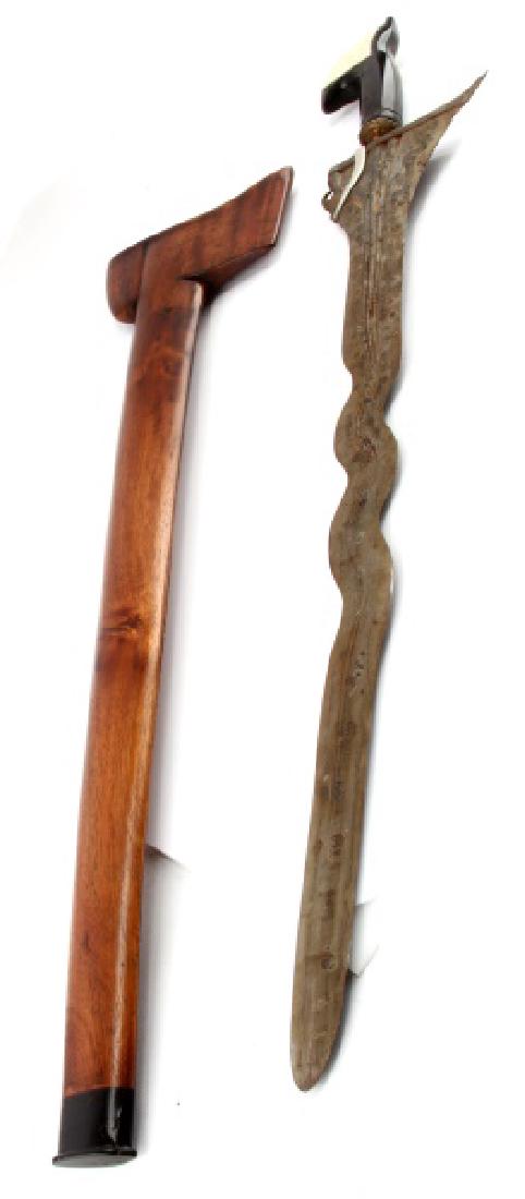 LARGE KERIS KRIS SWORD INDONESIAN HORN AND BONE: 33" total length, 27" blade. Horn handle with bone inlay an wood scabbard.