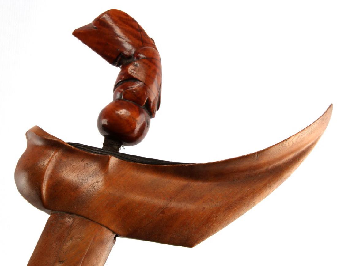 INDONESIAN KRIS KERIS DAGGER AND SCABBARD: The STRAIGHT hand-forged steel blade measures 3-cm (14 inches). The angled, carved wooden handle measures 13-cm in gross length (5-1/8 inches). No stirrups are present and the blade and guard (Wilah a
