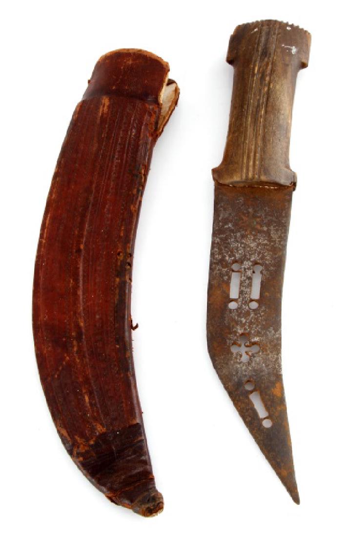 OTTOMAN DAGGER MIDDLE EASTERN JAMBIYA: Late 19th century Ottoman dagger and leather scabbard. Overall blade shape is similar to the traditional Yemeni Jambiya. Rather than a medial ridge, this example has geometric shapes punched through t