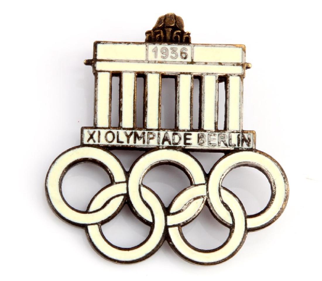 1936 BERLIN OLYMPICS BRADENBURG GATE PIN: Enamel pinback. Reverse marked "WD Ges. Gesch." Unauthenticated, sold as-is. This lot has a reserve.
