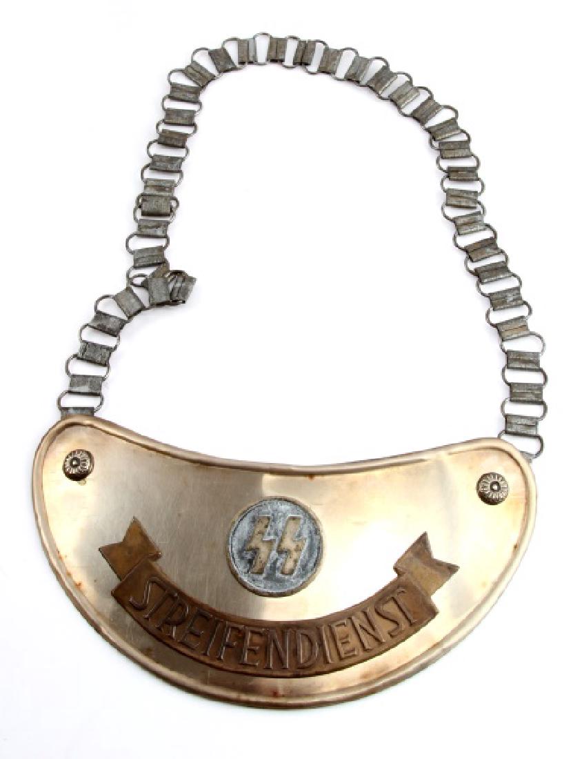 GERMAN WWII SS GERMAN PATROL GORGET WITH CHAIN: Light wear and discoloring present to gorget; overall in very good condition. Unauthenticated as is. This lot has a reserve.