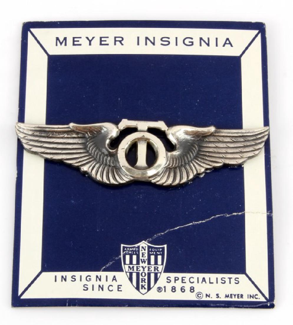 WWII USAAF AIR FORCE TECHNICAL OBSERVER TO WING: USAAF WWII Army Air Force Technical Observer TO Wing. Measures 3 3/16" wide by 13/16" tall. The reverse side is maker marked 'Meyer New York' in their shield logo. Pin back. Mounted on a Meyer cardboa