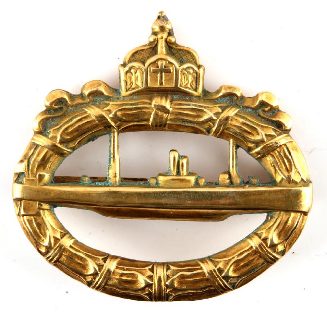 WWI IMPERIAL GERMAN NAVY U-BOAT SUBMARINE BADGE: A Imperial German Navy WWI U-Boat Submarine badge measuring 1-7/8 inches wide by 1-13/16 inches tall. The reverse of the brass badge has a thin, 180-degree lie, pin back. Unauthenticated, sold as is.