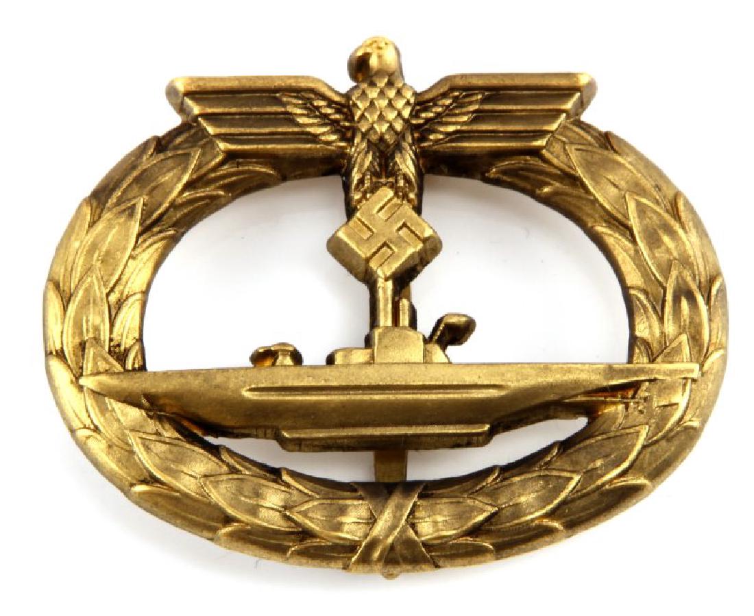 WWII GERMAN NAVAL U-BOAT SUBMARINE SAILOR BADGE: German WWII Naval U-Boat Submarine Sailor Badge. The reverse side is maker marked 'Schwerin Berlin 68'. Has a wide vertical pin back. Brass construction. Unauthenticated, sold as is.