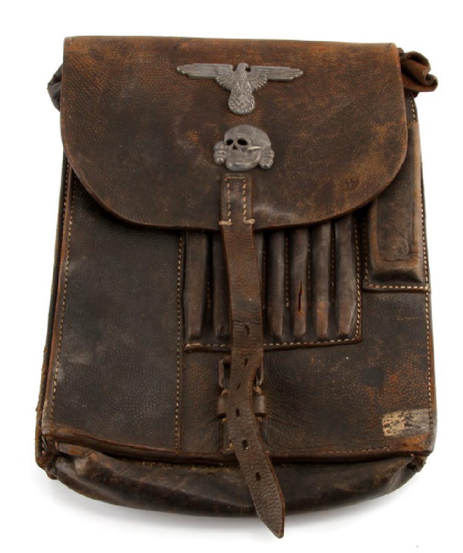 WWII 3RD REICH GERMAN WAFFEN SS OFFICERS MAP CASE: A German WWI Waffen Schutzstaffel (SS) Officer's Leather Map Case measuring 7-5/8 inches wide by 11-1/8 inches tall. The front flap has an attached SS Totenkopf (skull) and Eagle and the "SS" runes st