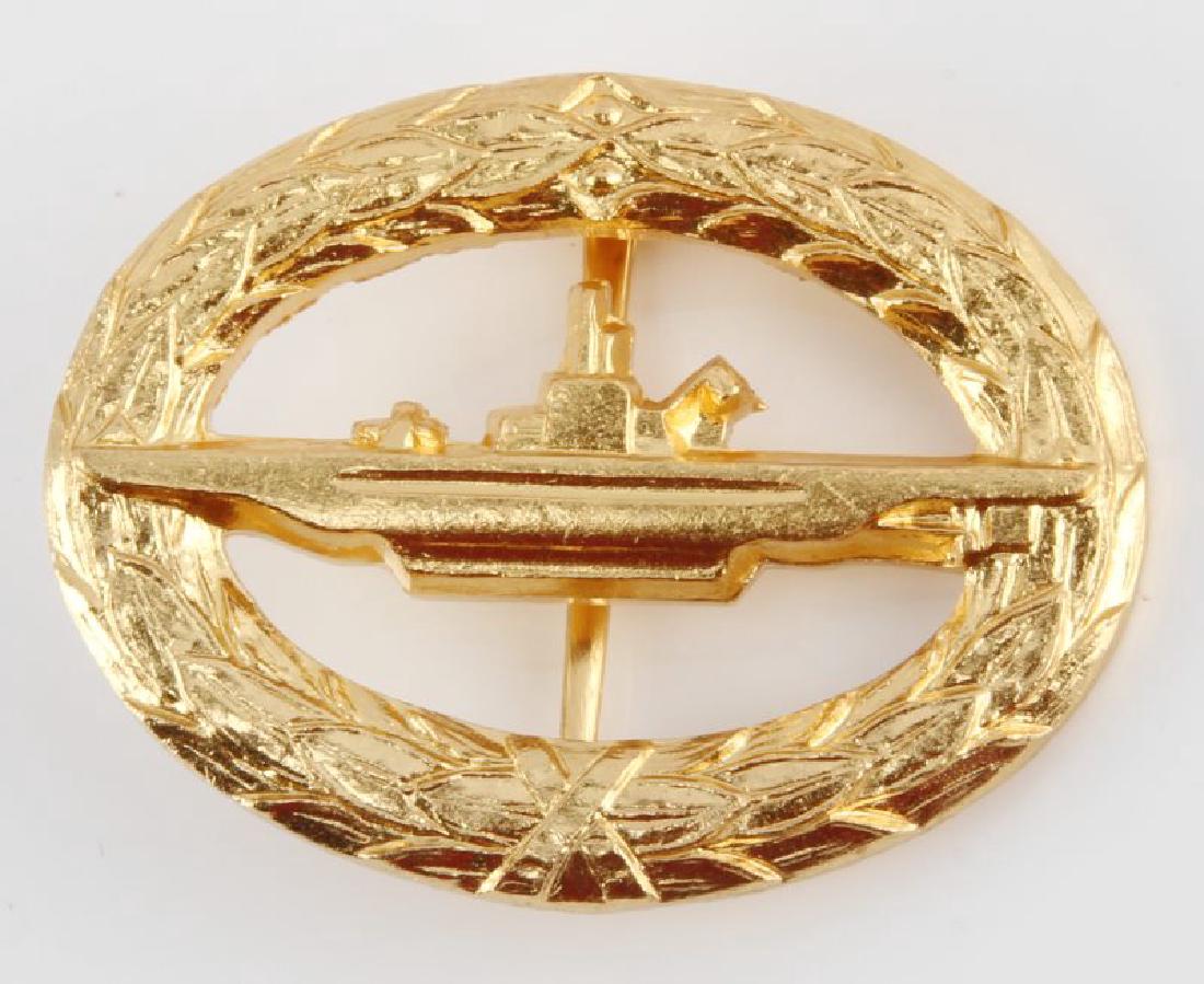 WWII WEST GERMAN NAVAL U BOAT SUBMARINE BADGE: West German WWII Naval U-Boat Submarine Qualification Badge. Has a wide vertical pin back. Measures 1 7/8" wide by 1 3/8" tall. Includes the cellophane presentation envelope. Brass construction. Unaut