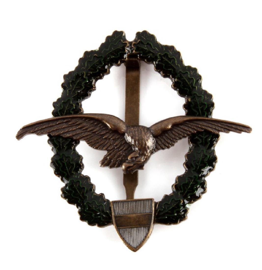 WWI AUSTRIA HUNGARY AVIATOR AXIS PILOT BADGE: Imperial Austria Hungary German WWI Aviator Axis Pilot Badge. Measures 2 3/8" wide by 2 1/4" tall. The reverse side is marked 'Souval Wien 7'. Has a wide vertical pin back. Two piece bronze constructi