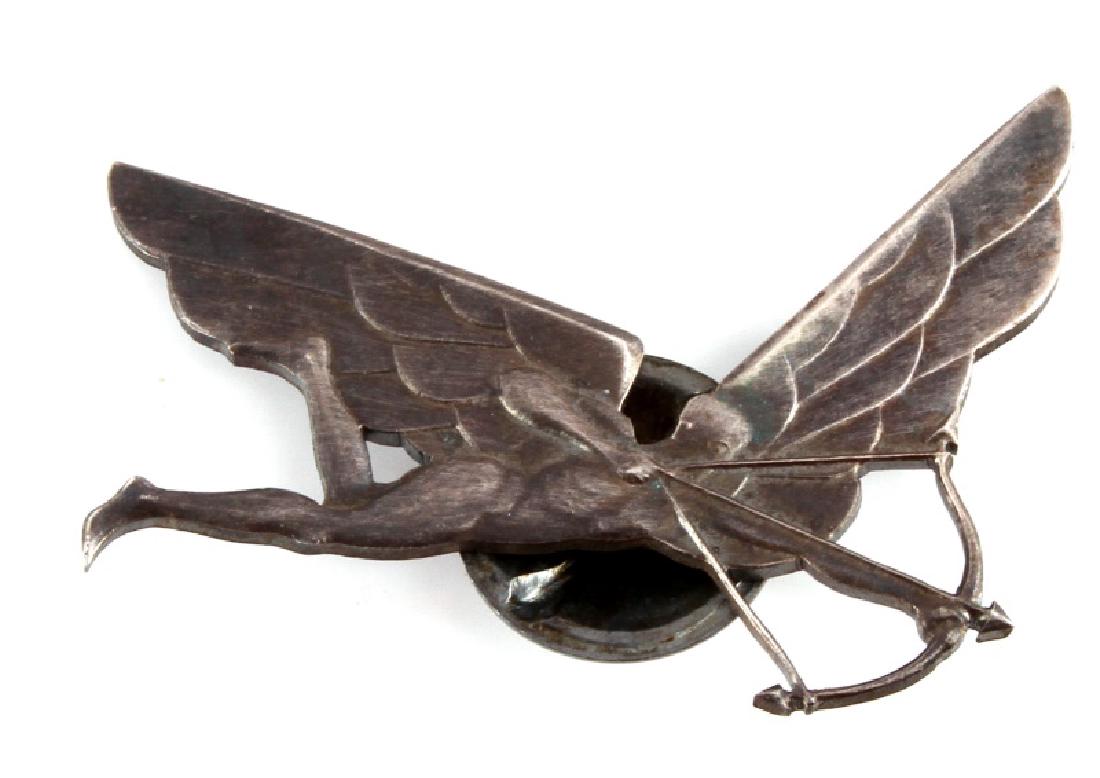 WW1 POLISH AVIATION AERIAL GUNNER BADGE: A WWI Polish viation aerial gunner badge measuring 2-11/16 inches wide by 2-1/8 inches tall. The nickel badge has a screw mount post and nut in the reverse. Unauthenticated, sold as is.