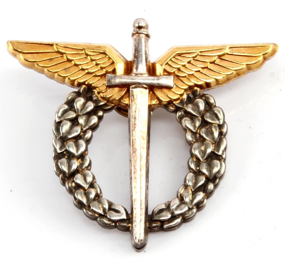 WWII CHECHOSLOVAKIAN AXIS PILOT WING BADGE: A WWII Czechoslovakian Axis Pilot's Wing Badge measuring 2-7/16 inches wide by 2-1/8 inches tall. The reverse of the nickel badge with gold plated wings has a screw mount post and nut. Unauthenticated