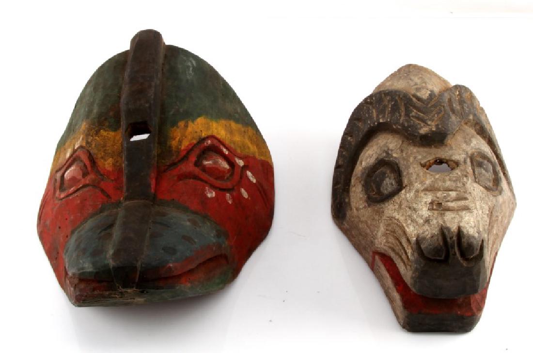 NATIVE AMERICAN PACIFIC NORTHWEST EFFIGY MASKS: Two effigy masks from the pacific Northwest, one of a bird and one of a ram. Both are hand-carved wood and hand painted. Both have central carved holes and no indication of attachments for wearing as 