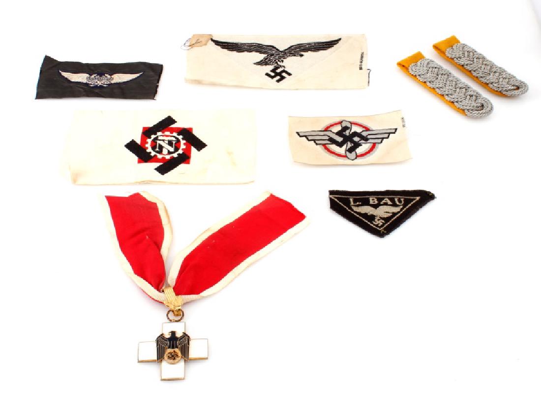 GERMAN NSDAP LUFTWAFFE LUFTSCHUTZ CROSS & PATCHES: Lot of German NSDAP wartime Luftwaffe and Luftschutz (post-war civil defense) patches maker marked, shoulder insignias maker marked, pair of collar tabs, and white enameled cross with Third Reich insi