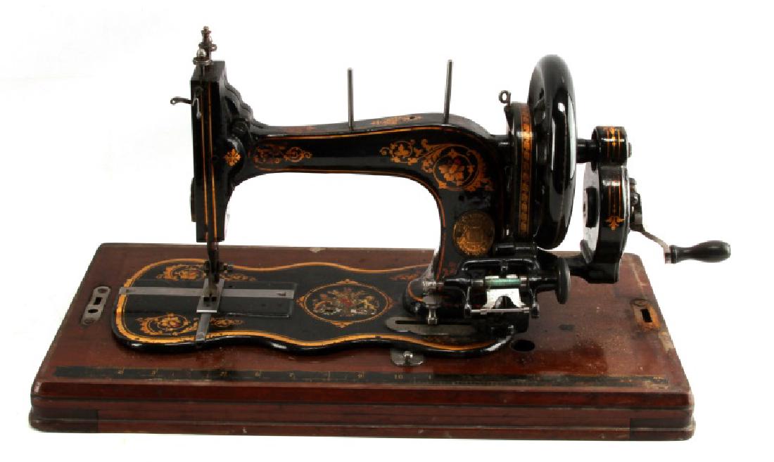 LATE VICTORIAN VARLEY FIDDLEBASE SEWING MACHINE: An English late Victorian (1850 to 1890) Varley & Co. "Cyclopes" hand crank sewing machine and original case. The Varley Cyclopes is modeled after the Singer model 12 of 1865 and is popularly known a