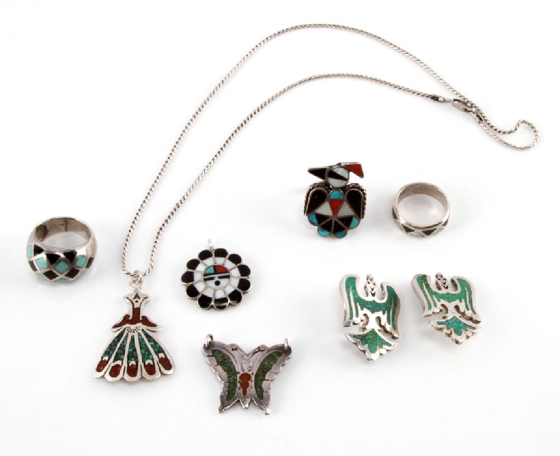 STERLING NAVAJO TURQUOISE MIXED STONE JEWELRY LOT: Lot of sterling silver Southwestern and Navajo styled inlay jewelry. Mixed stones include mother of pearl, turquoise, coral, and onyx. The rings are sizes 6-8. Also includes assorted charms and a neck