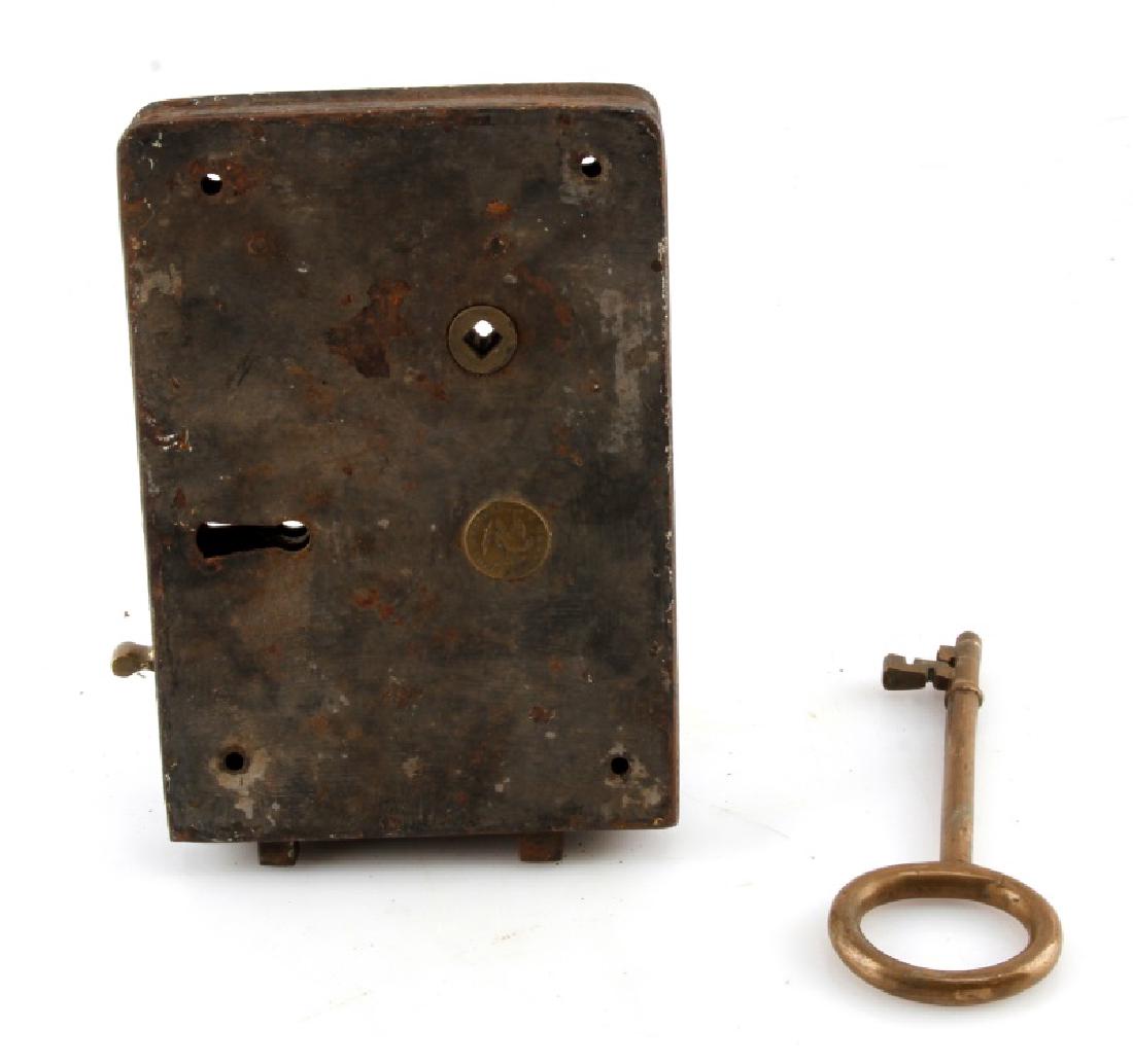 WROUGHT IRON AND BRASS CARPENTER STYLE LOCK & KEY: A rare wrought iron English Carpenter's lock assembly and large bronze key. The lock assembly measures 8 inches by 5-1/2 inches by 1 inch (20.3 cm X 14 cm X 2.5 cm). The The large bronze skeleton key 