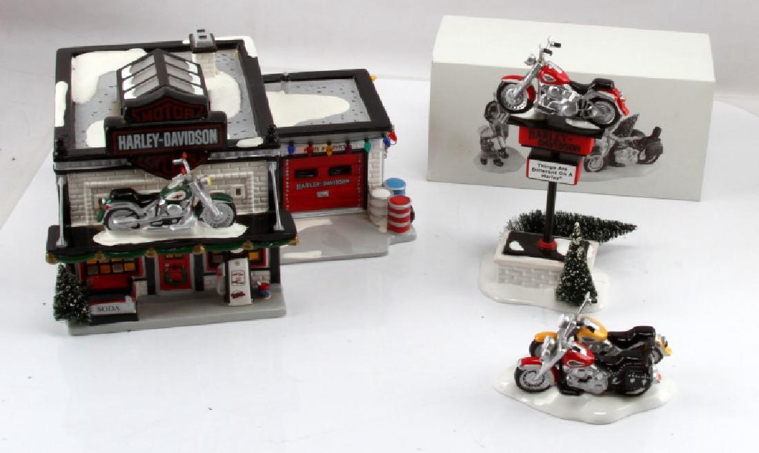 SNOW VILLAGE HARLEY DAVIDSON FOUR PIECE LOT: Snow Village four Harley Davidson pieces. Lot includes "A Harley Davidson Holiday," "Harley Davidson Fat Boy & Soft Tail," "Harley Davidson Sign," and "Harley Davidson Motorcycle Shop."