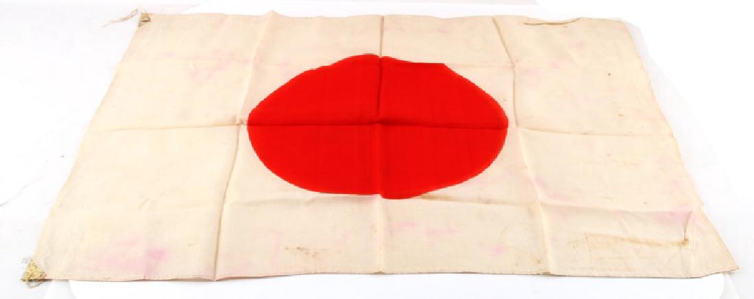 WWII-ERA VETERAN BRING BACK JAPANESE MEATBALL FLAG: WWII era Japanese meatball flag in silk measuring 18'' BY 25'' . Veteran bring back, in good condition despite expected aging and some discoloration with no holes or tears with metal tip on corners & 