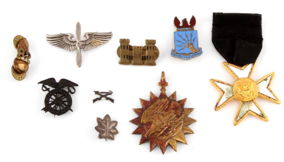 WWII US MILITARY MEDALS ASSORTED: Airforce cadet medal (1.75", sterling), Lt. Colonel (0.5" sterling), infantry rifles (0.5" sterling), Air Medal (some discoloration), black Quartermaster Corps pin (1"), Meyer New York 82 Artillery cl