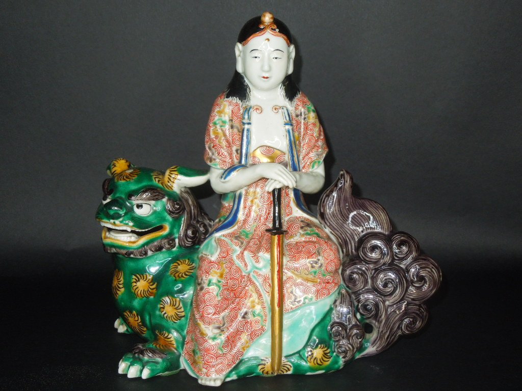 ANITQUE PORCELAIN FIGURE: Rare Porcain Famille verte Figure of a Youngman Holding a sword seating on a lion. H: 9 1/2" W: 9 3/4" D: 5 1/2"