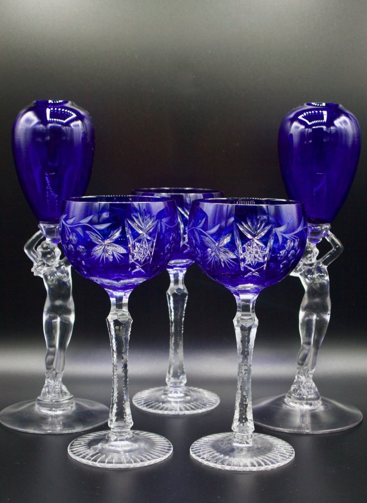 3 Bohemian cobalt wine glasses and 2 vases: Three count Bohemian cobalt cut to clear hock wine glasses and a pair of cobalt Cambridge glass ivy vases, all circa 1925. Glassware has a meandering grape vine cut glass pattern on bowl and six-sided