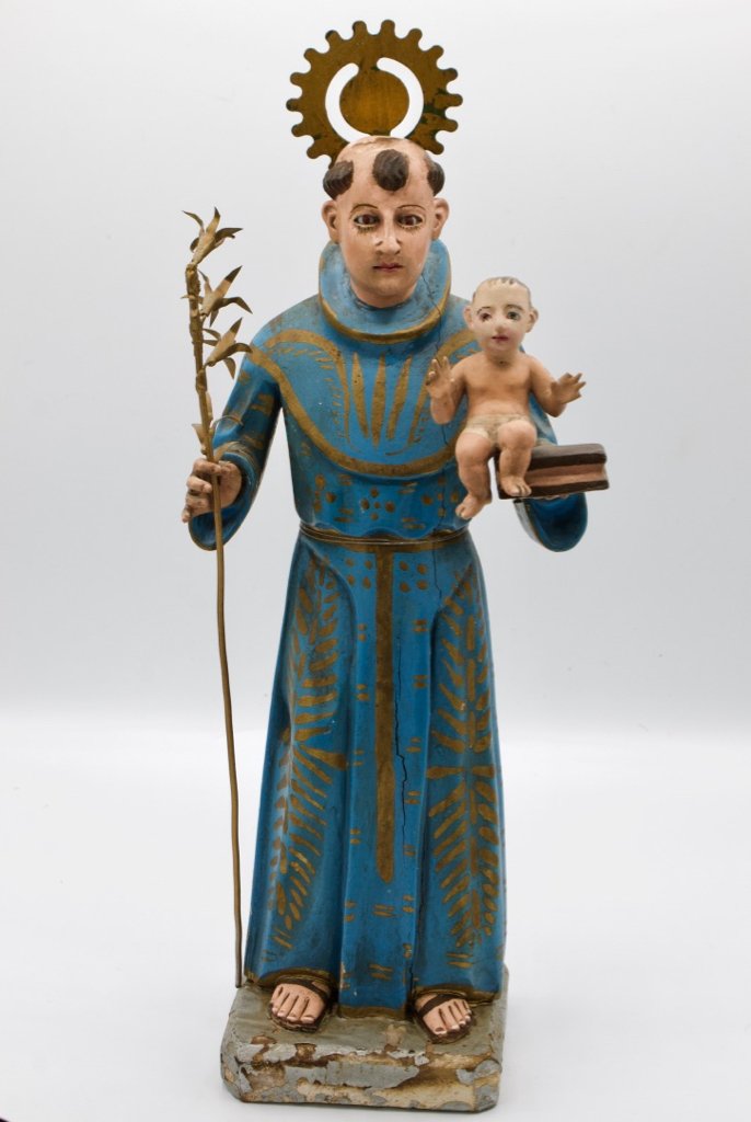 Santos, St. Joseph with the infant Jesus: Santos, St. Joseph with the infant Jesus: Spanish Colonial, polychrome painted carved wood statue showing Joseph in Monk's robe with gold trim and holding the infant Jesus and a book in his left arm.