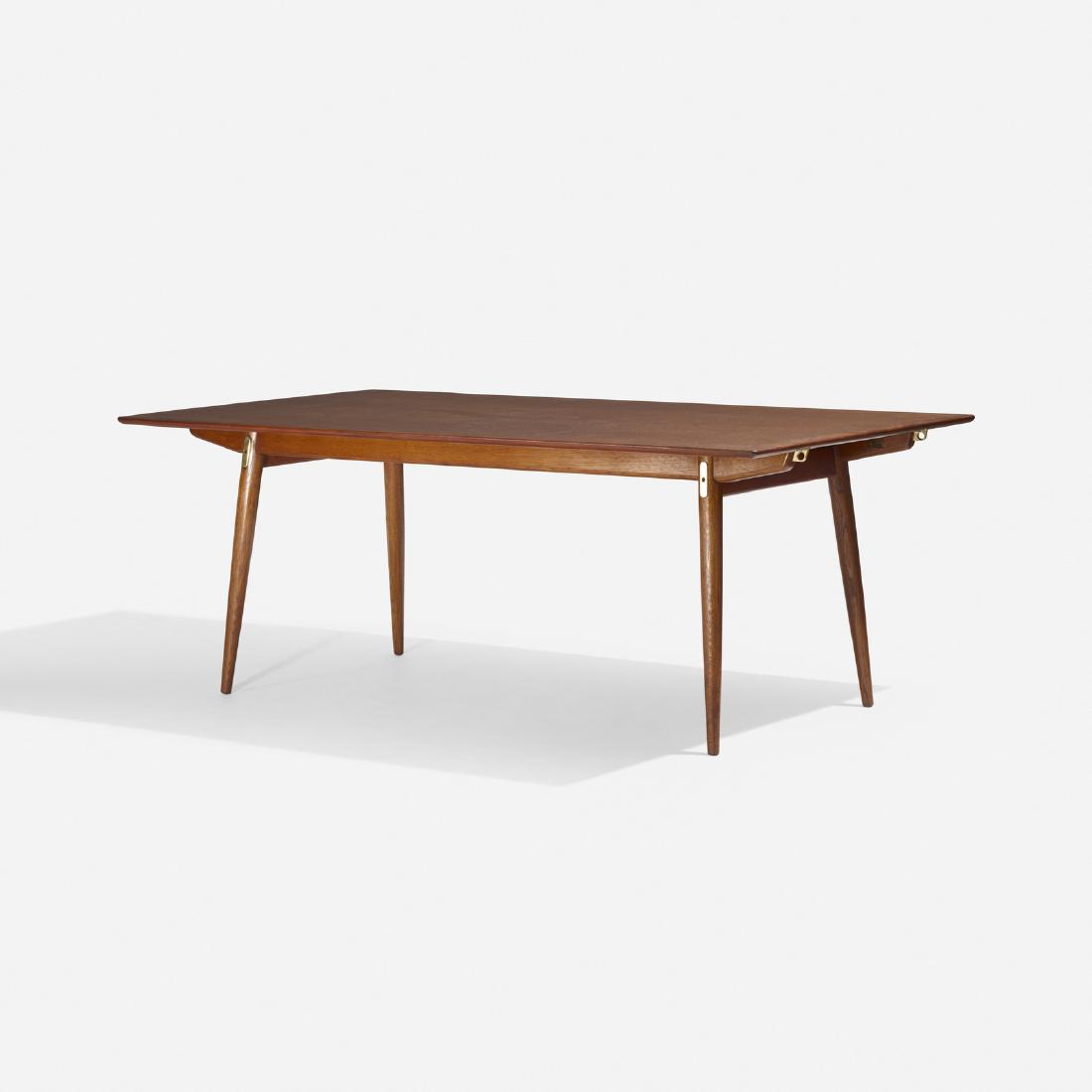 Hans J. Wegner, dining table, model JH570: Hans J. Wegner dining table, model JH570 Johannes HansenDenmark, 1953stained teak, stained oak, brass76.75 w x 41.75 d x 29 h in (195 x 106 x 74 cm) Sold with two 20.75-inch leaves; table m