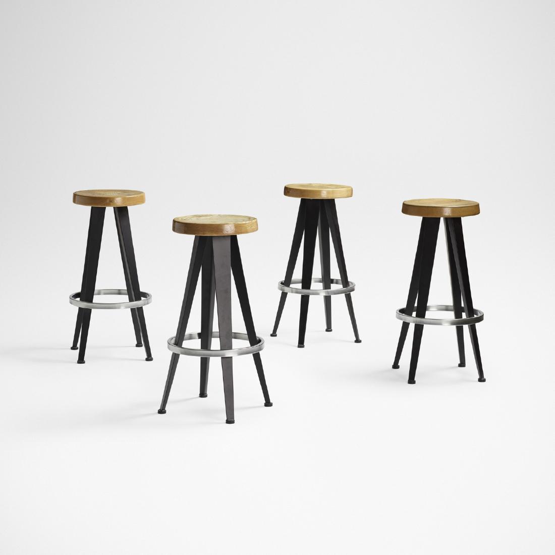 After Jean Prouve, stools, set of four: After Jean Prouve stools, set of four France, c. 1985 enameled steel, ash, oak, chrome-plated steel 14 dia × 27.75 h in (36 × 70 cm)