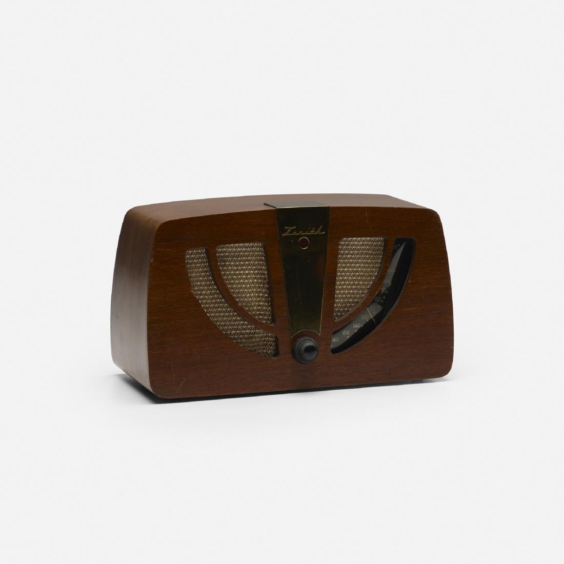 Charles and Ray Eames, radio, model 6D030: Charles and Ray Eames radio, model 6D030 Evans Products/Hoffman Radio CorporationUSA, 1946walnut plywood, brass, upholstery, Bakelite, plastic13.5 w × 6.5 d × 7.75 h in (34 × 17
