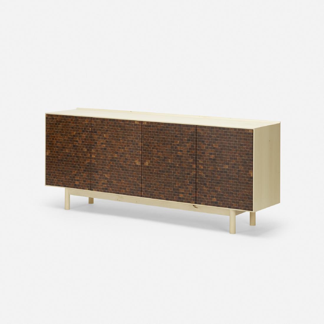 Klotzwrk, credenza: Klotzwrk credenza USA, c. 2010 holly, walnut 76 w × 16.75 d × 31.5 h in (193 × 43 × 80 cm) Credenza features four doors concealing five shelves and one drawer.