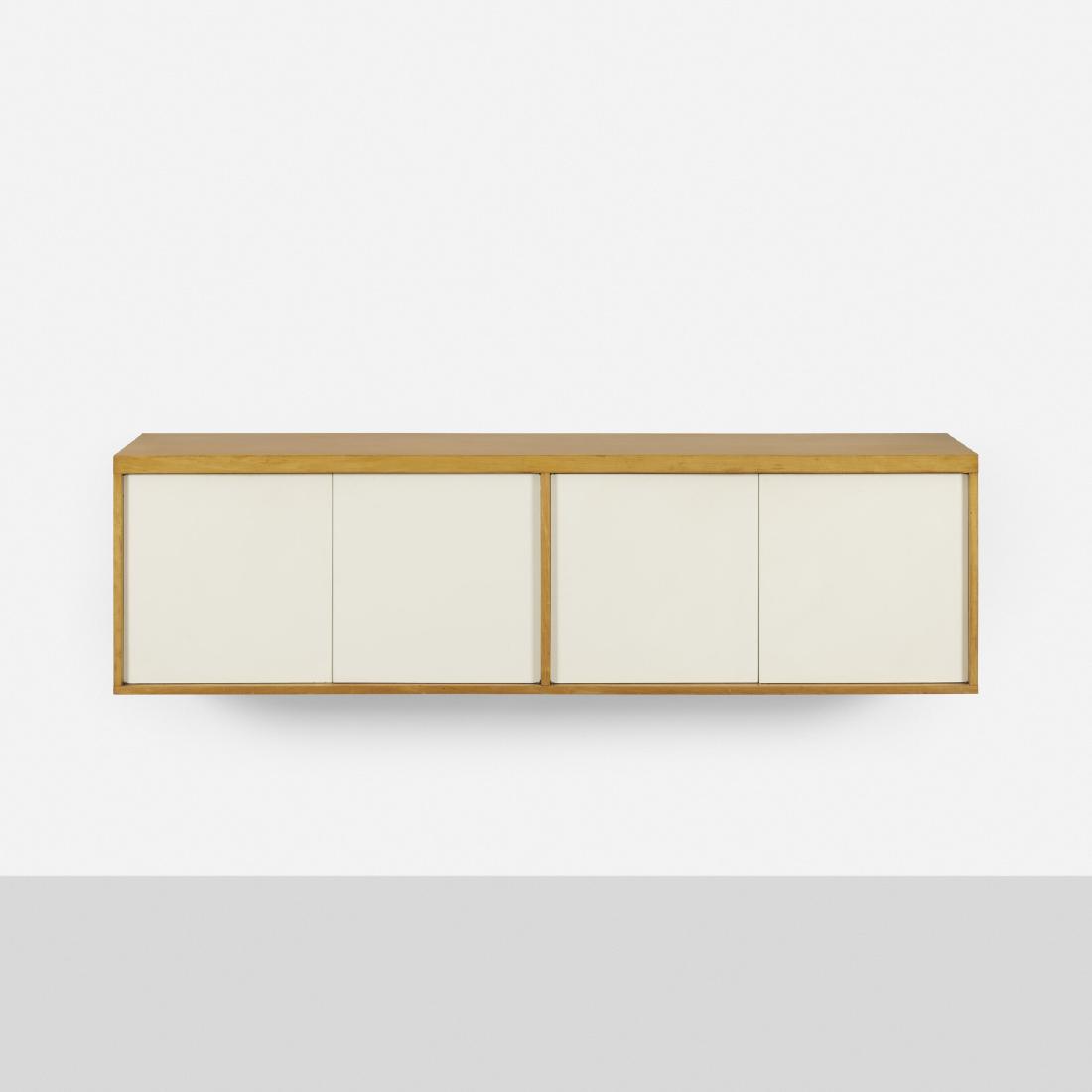 Paul Rand, custom wall-mounted cabinet: Paul Rand custom wall-mounted cabinet for the Rand House USA, c. 1960birch, lacquered wood72 w × 20 d × 20 h in (183 × 51 × 51 cm) Cabinet features four doors concealing t