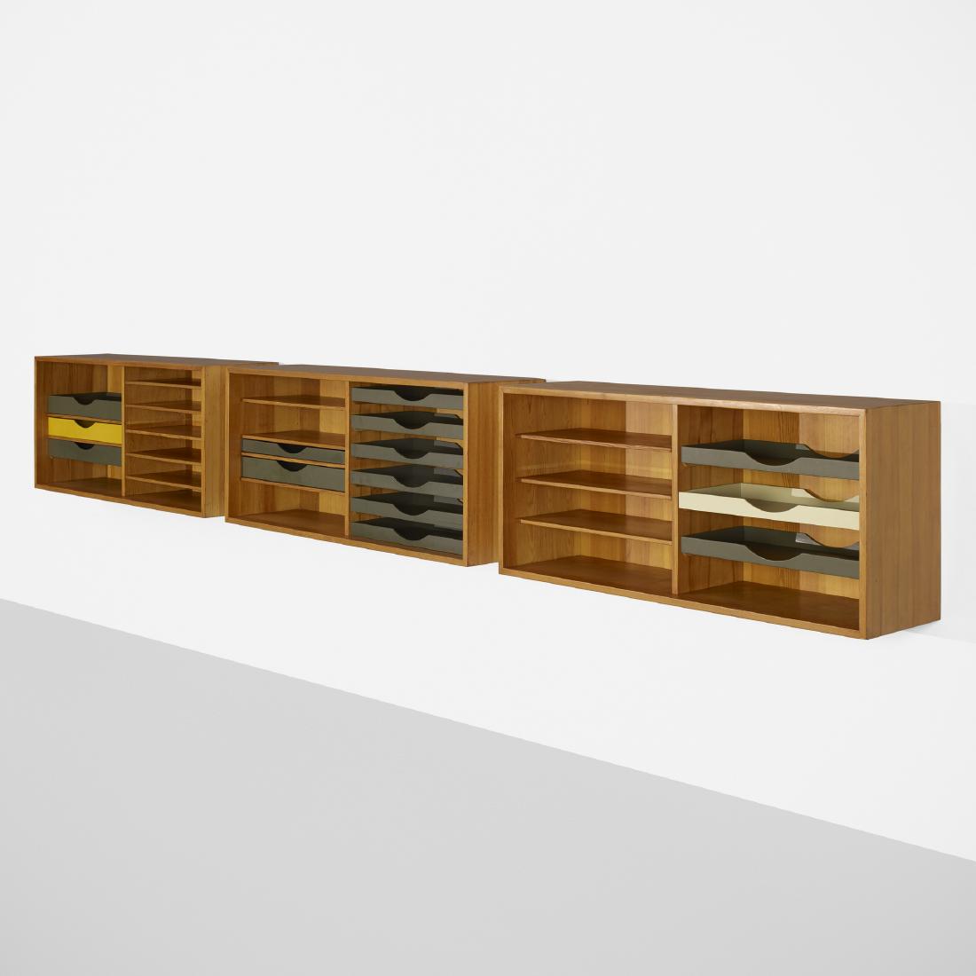 Borge Mogensen, wall-mounted cabinets, set of three: Borge Mogensen wall-mounted cabinets, set of three Karl Andersson & SonerDenmark / Sweden, c. 1955pine, lacquered wood53 w × 14 d × 23 h in (135 × 36 × 58 cm) Cabine