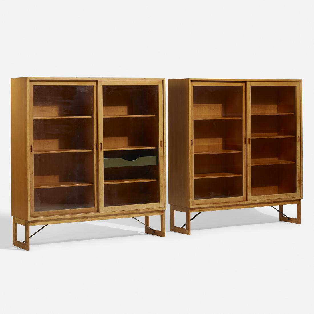 Borge Mogensen, display cases, pair: Borge Mogensen display cases, pair Karl Andersson & SonerDenmark / Sweden, c. 1955pine, glass, enameled steel53 w × 14.25 d × 56.25 h in (135 × 36 × 143 cm) Each cas