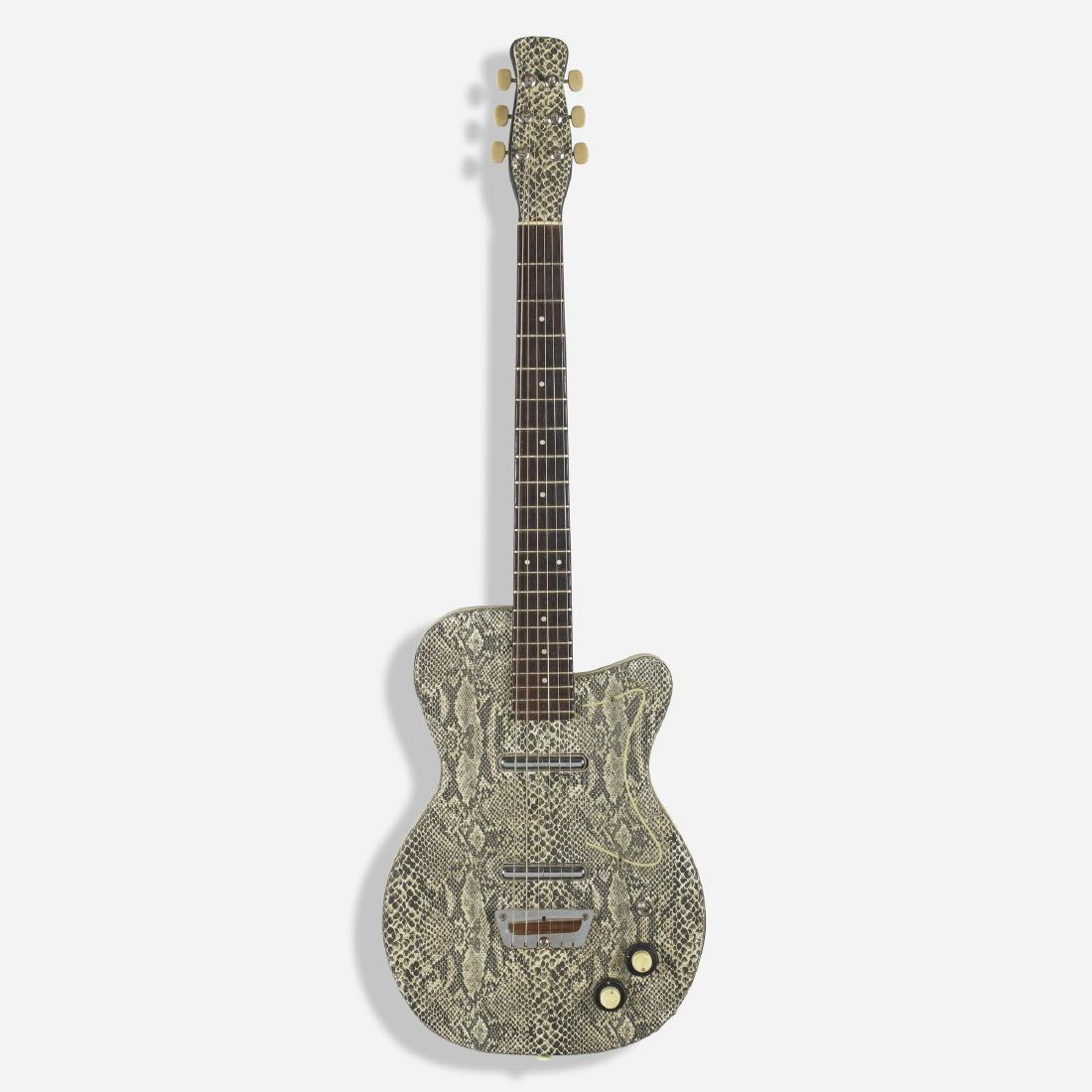 Danelectro, Custom U2 electric guitar: Danelectro Custom U2 electric guitar c. 1950 masonite, lacquered wood, rosewood, chrome, chrome-plated steel, plastic, aluminum 12 w × 2 d × 38 h in (30 × 5 × 97 cm) Guitar