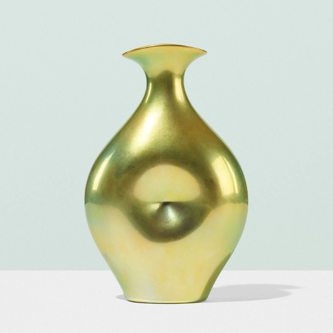 Eva Zeisel, Belly Button vase: Eva Zeisel Belly Button vase ZsolnayHungary, 1983eosin glazed porcelain5 w × 2.5 d × 8 h in (13 × 6 × 20 cm) Stamped manufacturer's mark to underside ‘Zsolnay Hungar