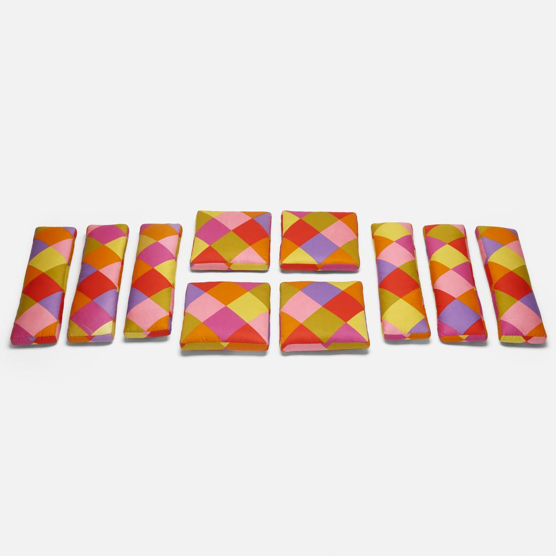 In the manner of Alexander Girard, set of ten cushions: In the manner of Alexander Girard set of ten cushions c. 1955 Girard fabric 31.5 w × 3.5 d × 8.5 h in (80 × 9 × 22 cm) Four examples measure: 15.25 w x 3 d x 16 h inches