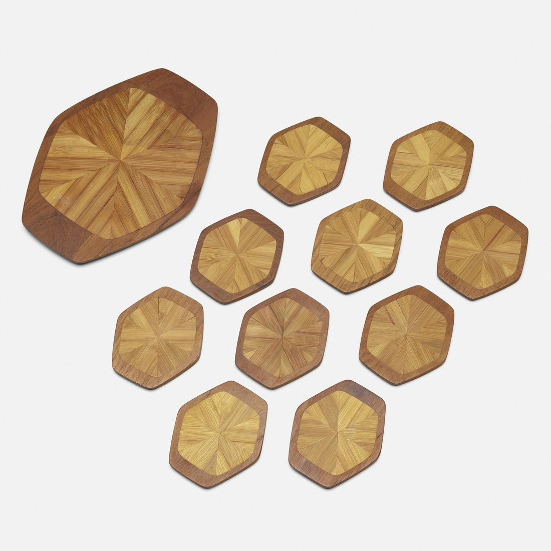 Jens Quistgaard, trivet and set of ten coasters: Jens Quistgaard trivet and set of ten coasters Dansk DesignsDenmark, c. 1965teak, bamboo9.5 w × 7.5 d × 0.5 h in (24 × 19 × 1 cm) Signed with partial stamped manufac