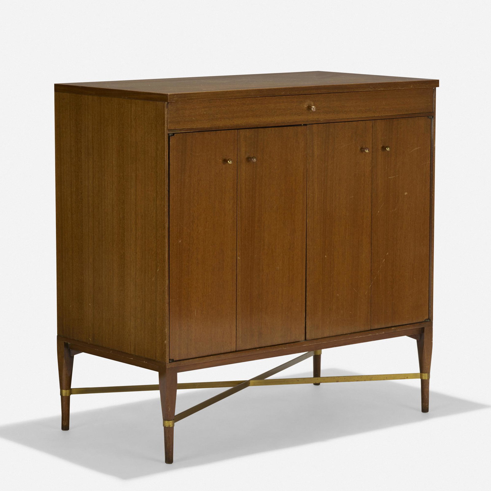 Paul McCobb, Irwin Collection cabinet, model 7303: Paul McCobb Irwin Collection cabinet, model 7303 Calvin USA, c. 1958 mahogany, brass 36 w × 19.75 d × 36 h in (91 × 50 × 91 cm) Two bifold doors conceal one open compar