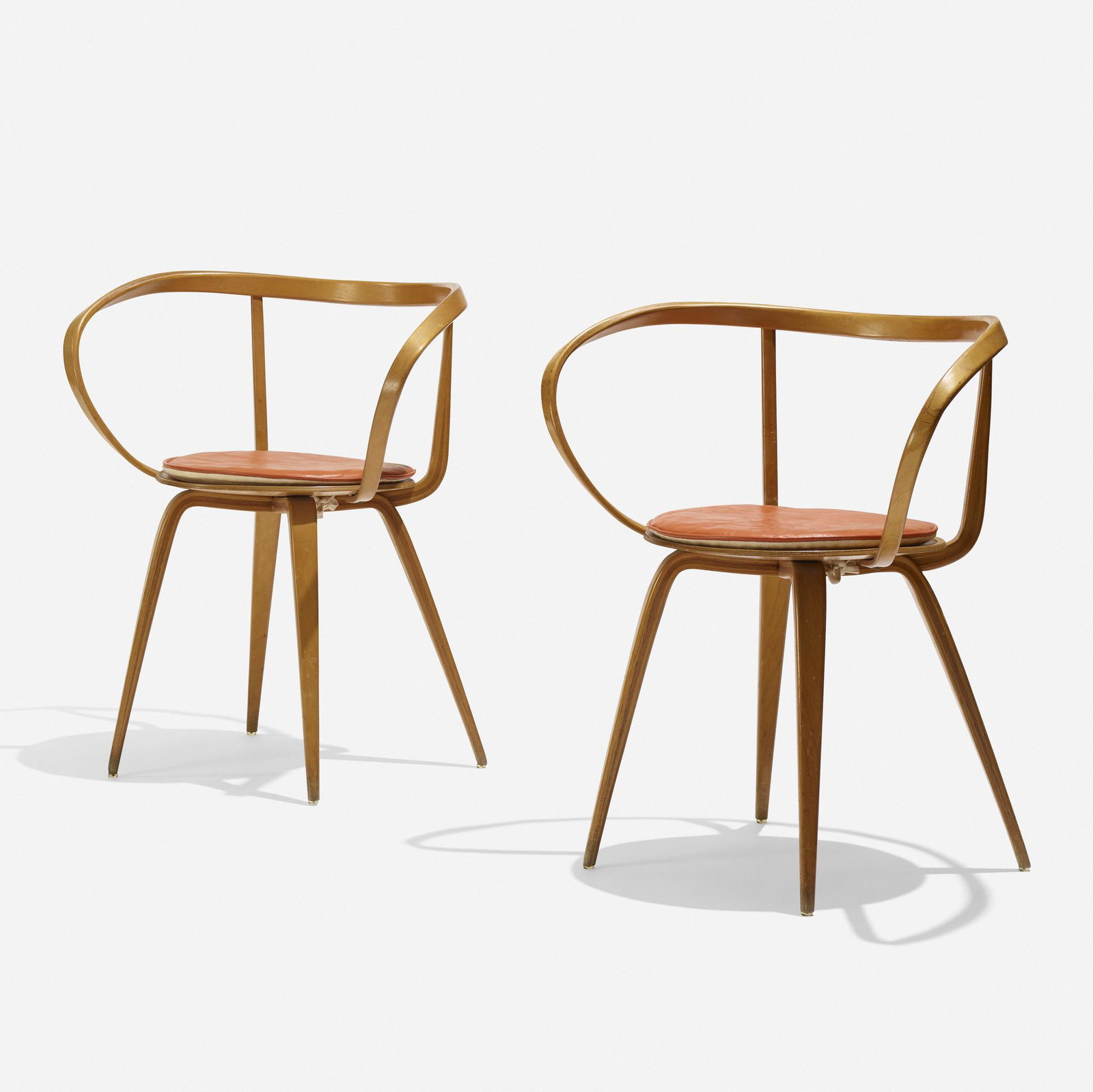 George Nelson & Associates, Pretzel armchairs: George Nelson & Associates Pretzel armchairs model 5890, pair Herman Miller USA, 1952 birch plywood, leather 26 w × 18.5 d × 30 h in (66 × 47 × 76 cm) Provenanc