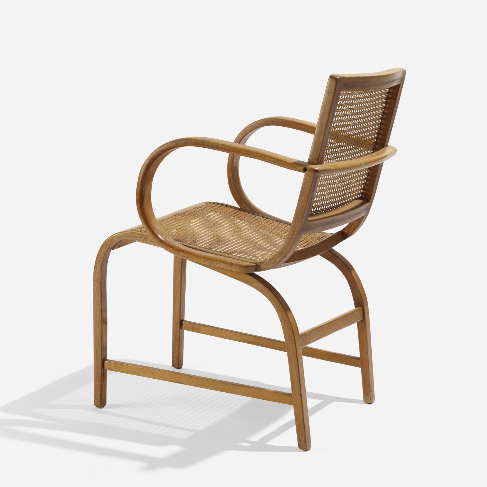In the manner of Erich Dieckmann, armchair: In the manner of Erich Dieckmann armchair c. 1935beech, cane22 w × 24.25 d × 34.25 h in (56 × 62 × 87 cm) Provenance: Collection of Michael and Gabrielle