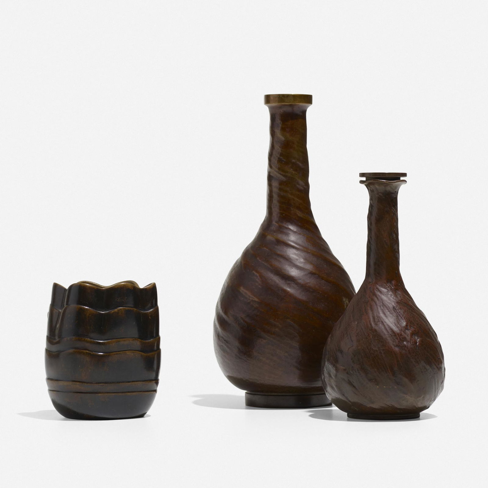 Evan Jensen, collection of three vases: Evan Jensen collection of three vases Denmark, c. 1937cast bronze3.5 dia × 7.25 h in (9 × 18 cm) Stamped to underside of each example 'Evan Jensen'. The smallest vase is an e
