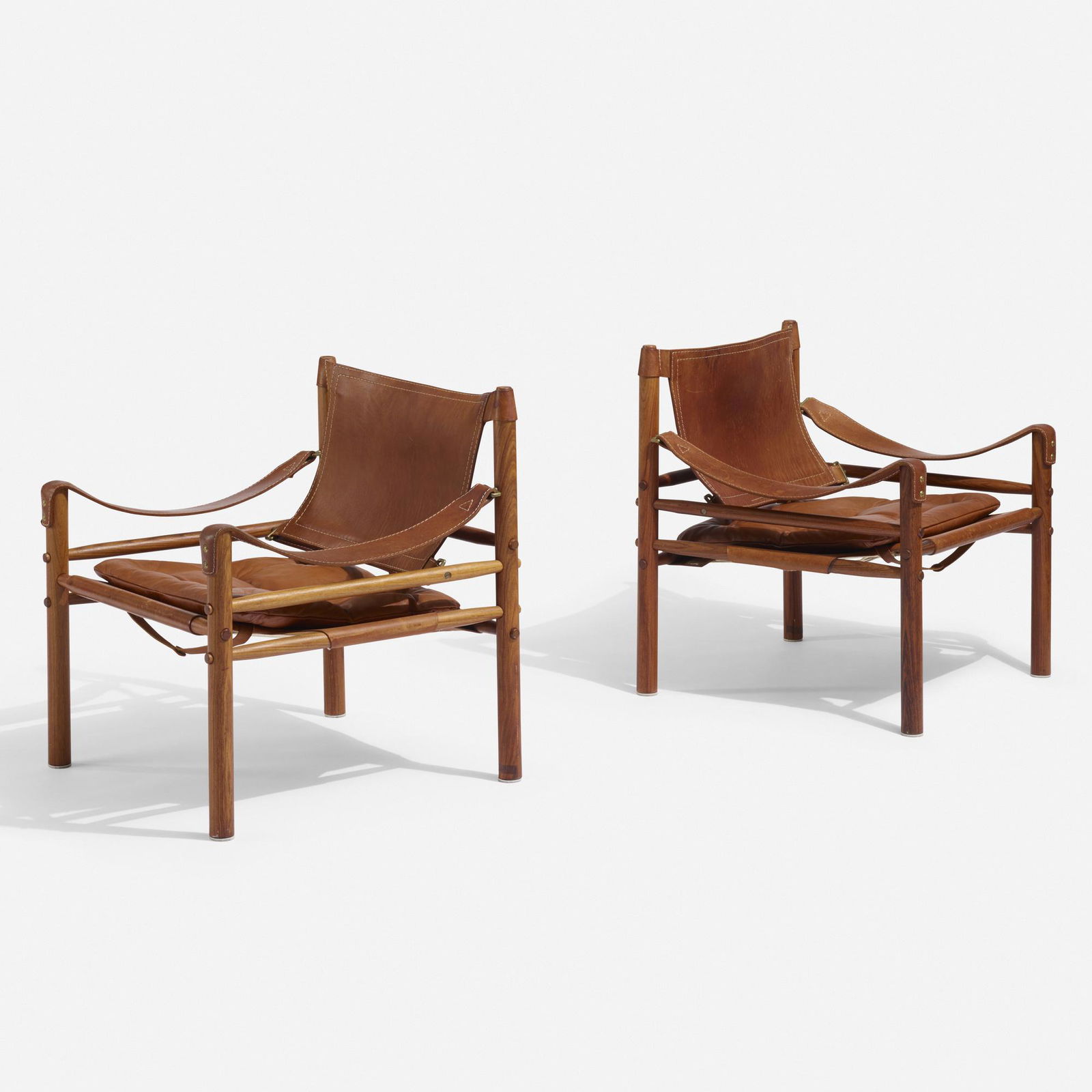 Arne Norell, Sirocco Safari lounge chairs, pair: Arne Norell Sirocco Safari lounge chairs, pair Arne Norell Mobel ABSweden, c. 1960teak, leather, brass26.5 w × 25.5 d × 28.5 h in (67 × 65 × 72 cm)