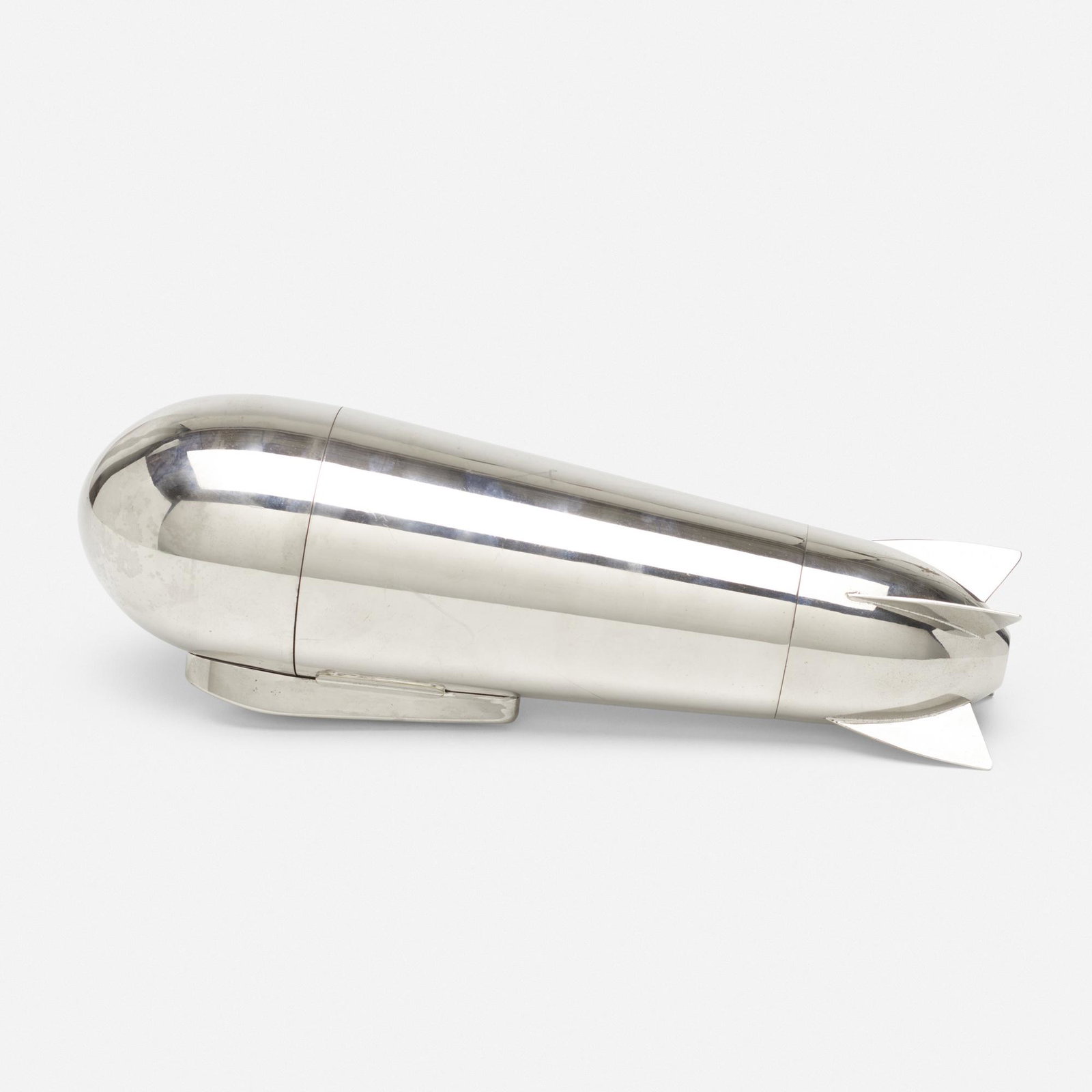 J.A. Henckels, Zeppelin cocktail shaker and traveling: J.A. Henckels Zeppelin cocktail shaker and traveling bar Germany, 1928 silver-plated brass 4.25 h × 12.25 w × 3.25 d in (11 × 31 × 8 cm) Set includes one spoon, four cups, f