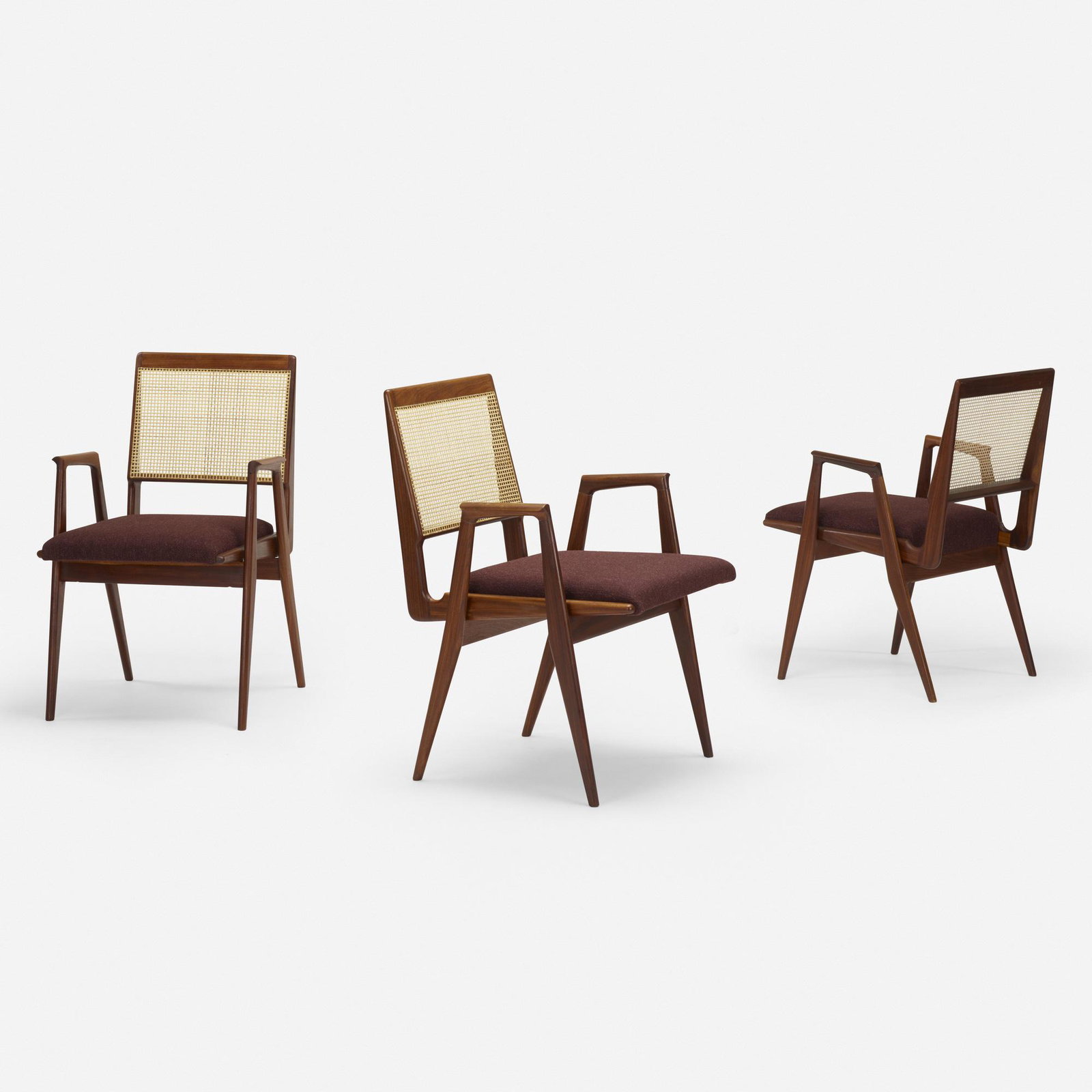 Martin Eisler and Carlo Hauner, armchairs, set of three: Martin Eisler and Carlo Hauner armchairs, set of three FormaAustria/Italy / Brazil, c. 1955jacaranda, cane, upholstery31.25 h × 20 w × 23 d in (79 × 51 × 58 cm)