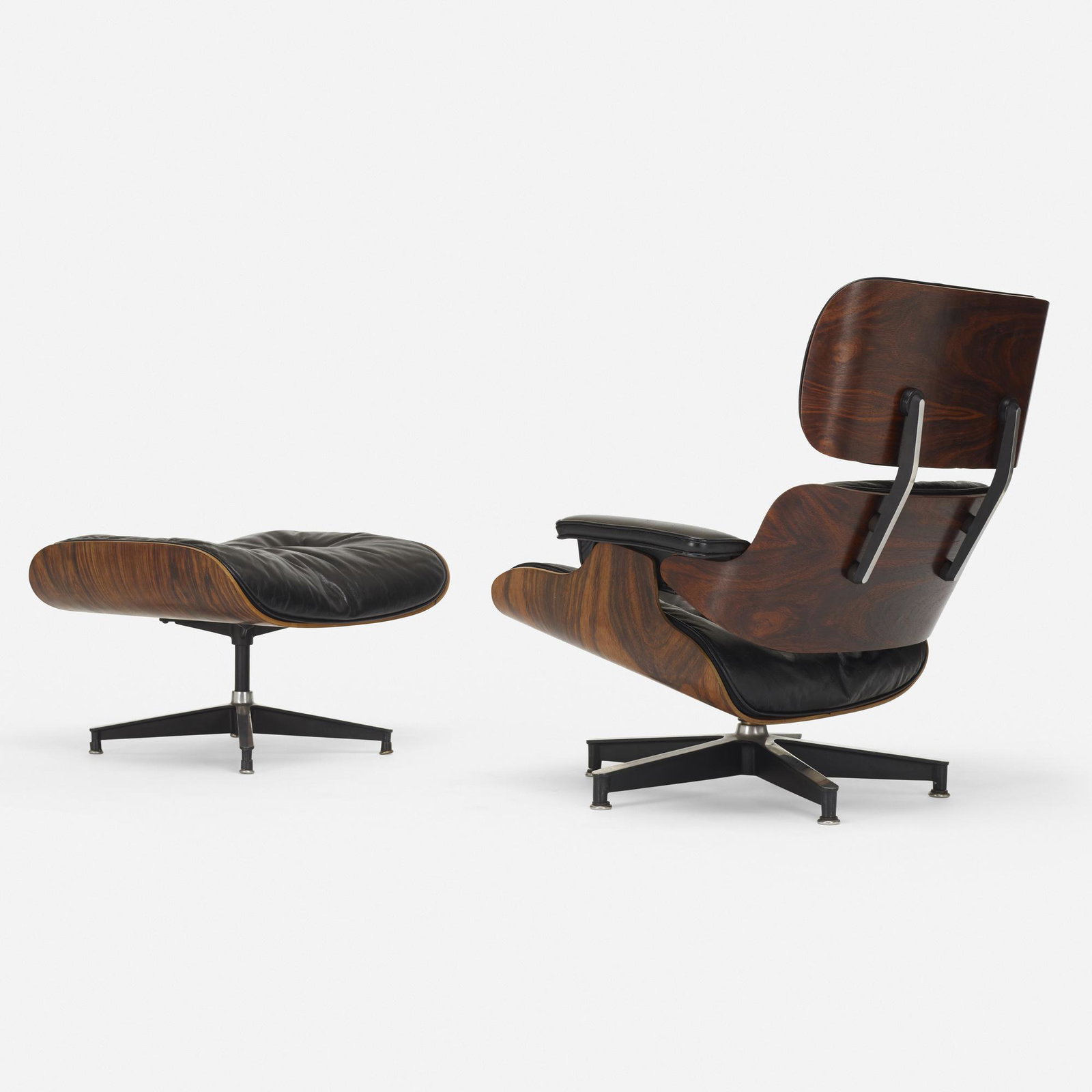 Charles and Ray Eames, 670 lounge chair and 671 ottoman: Charles and Ray Eames 670 lounge chair and 671 ottoman Herman Miller USA, 1956 molded rosewood plywood, leather, enameled aluminum, enameled steel, rubber 34.25 h × 33.25 w × 31.5 d in (8