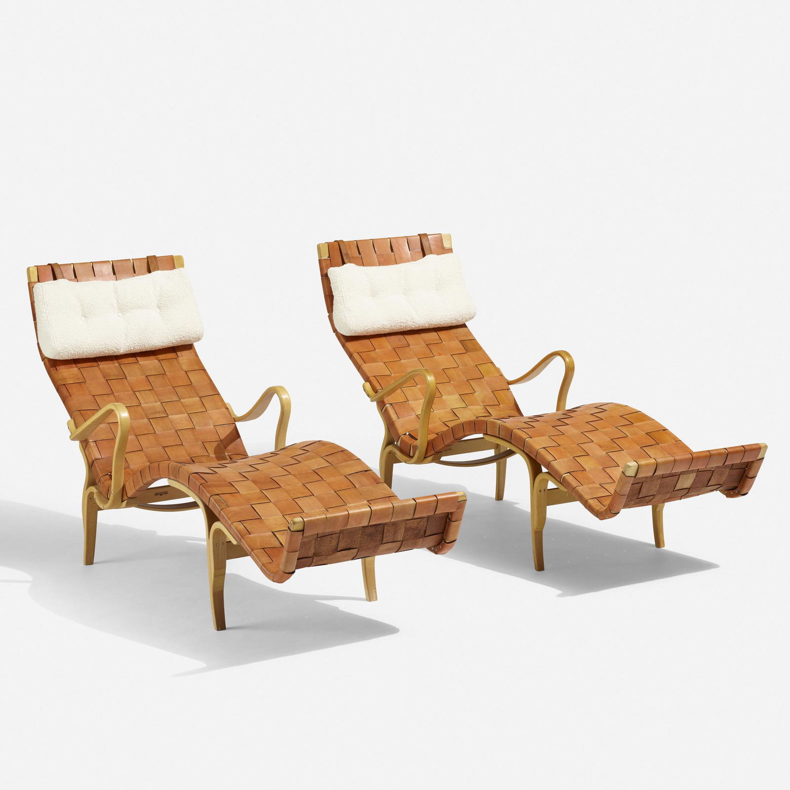 Bruno Mathsson, Pernilla 3 lounge chairs, pair: Bruno Mathsson Pernilla 3 lounge chairs, pair Firma Karl MathssonSweden, 1942 / 1959/1970laminated and steam-bent beech, leather, upholstery25 w × 69 d × 35.5 h in (63 × 175 &tim