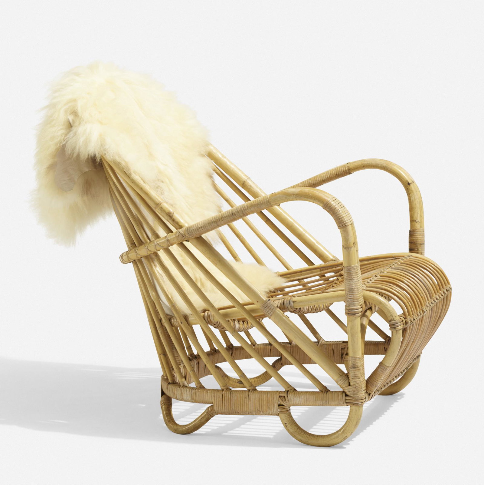 Arne Jacobsen, Charlottenborg lounge chair: Arne Jacobsen Charlottenborg lounge chair Nissen & Co. Denmark, 1936 / c. 1955 bamboo, rattan, sheepskin 27 w × 33 d × 31 h in (69 × 84 × 79 cm) Originally named Can