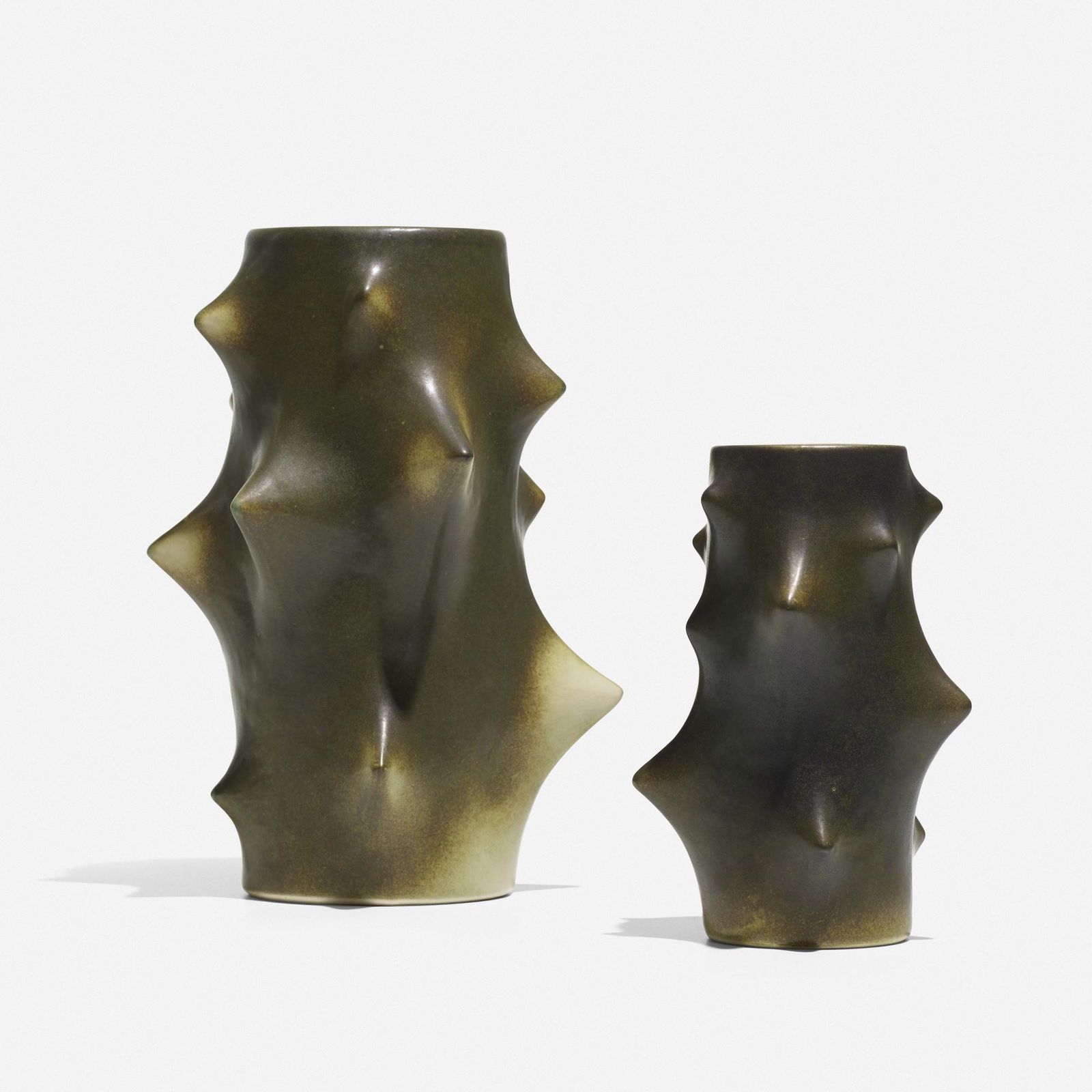 Knud Basse, vases, set of two: Knud Basse vases, set of two Michael Andersen & SonDenmark, c. 1955glazed ceramic6 dia × 10 h in (15 × 25 cm) Smaller example measures: 4.5 dia x 6.75 h inches. Impressed man