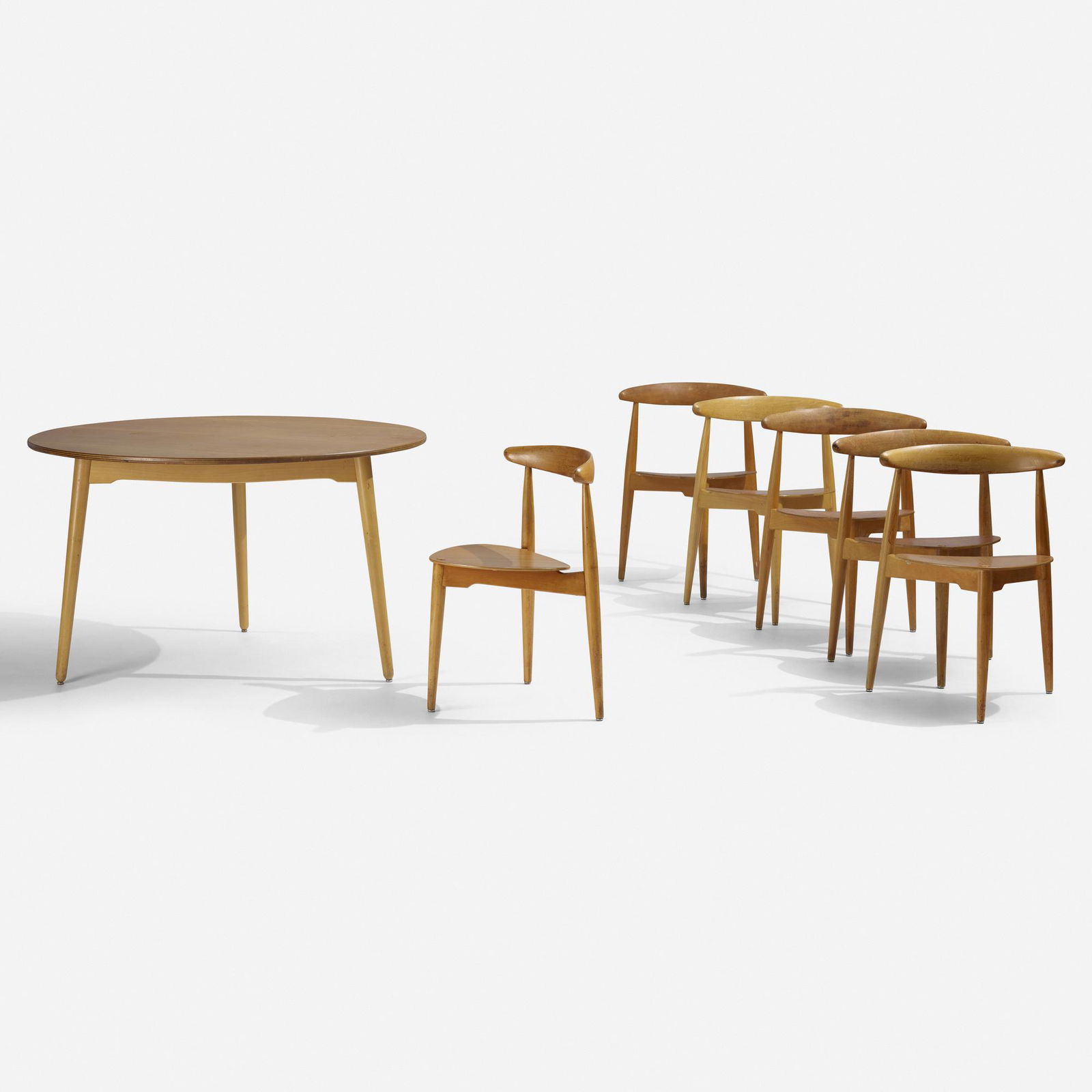 Hans J. Wegner, dining set, model FH4103: Hans J. Wegner dining set, model FH4103 Fritz HansenDenmark, 1952beech, oak plywood47.25 dia × 28 h in (120 × 71 cm) Set includes table and six chairs measuring: 21 w x 18 h x 2