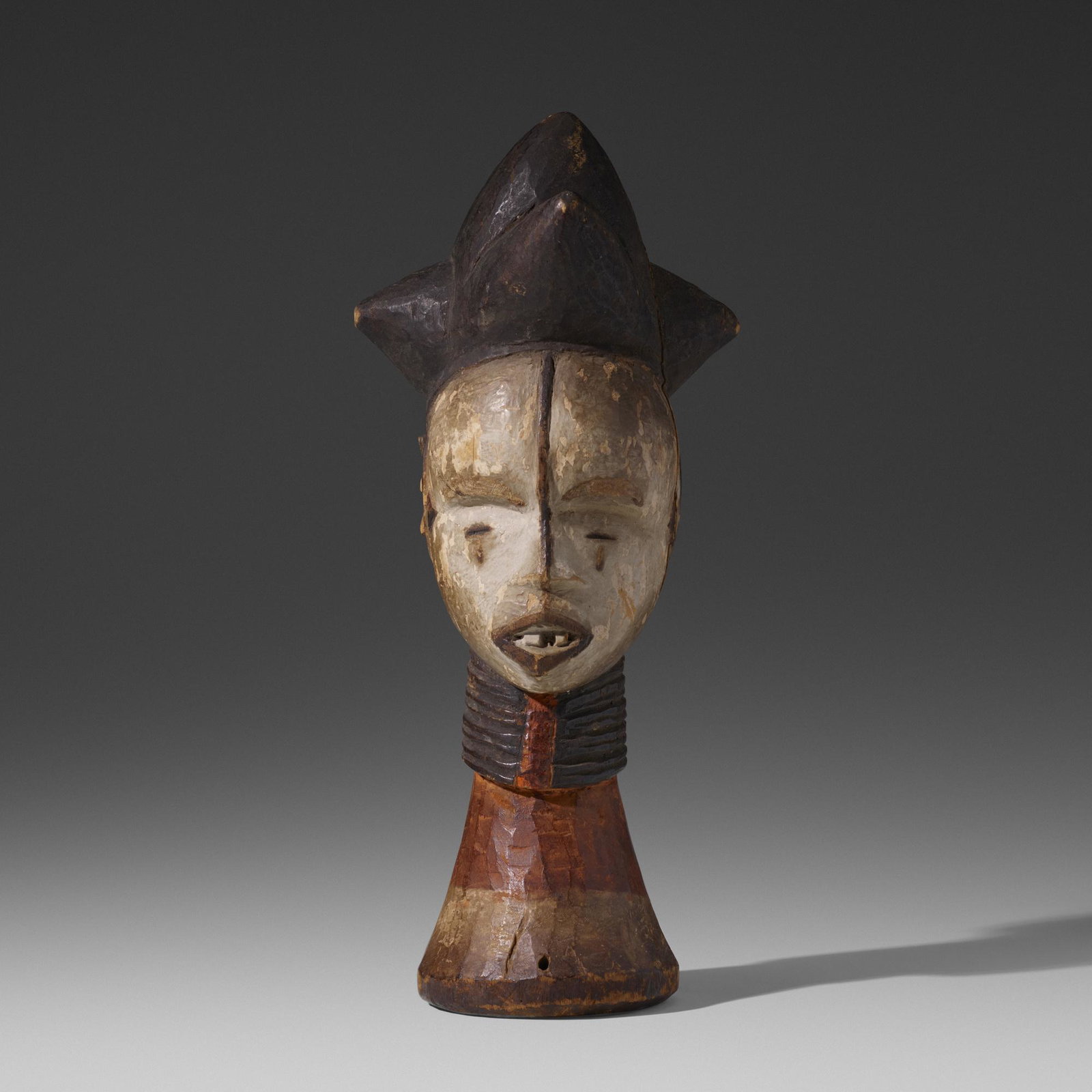 Idoma artist, Oglinye Society headcrest: Idoma artist Oglinye Society headcrest Nigeria, 20th century carved and painted wood 7 w × 7.5 d × 15.5 h in (18 × 19 × 39 cm) Provenance: Collection of Mar