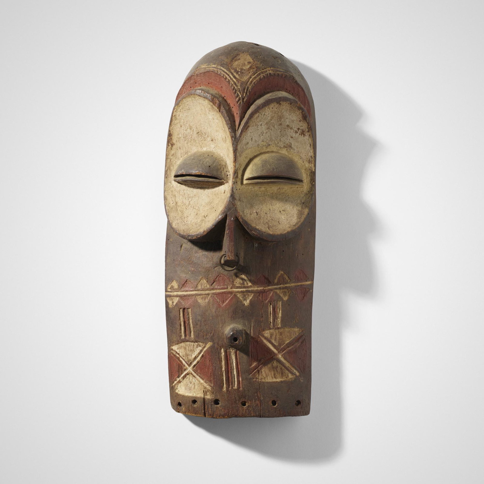 Bembe artist, Emangungu mask: Bembe artist Emangungu mask Democratic Republic of the Congo, 20th century carved and painted wood 6 w × 3 d × 15 h in (15 × 8 × 38 cm) Provenance: Collecti